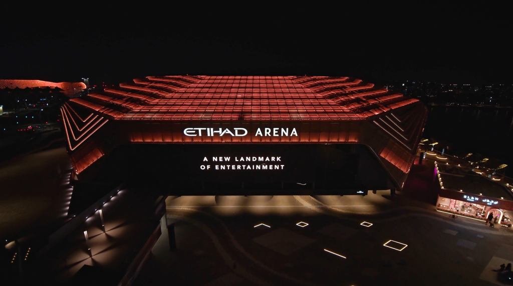 Etihad Arena illuminated at night on Yas Island, Abu Dhabi