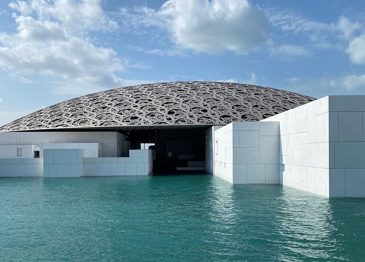 The Louvre Abu Dhabi beside the water